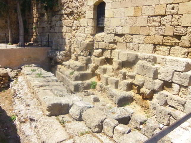 Picture of ancient ruins used as basement for a neoclassic edifice in Rhodes, Greece.